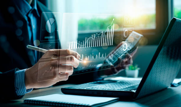 Analyst reviewing market data and charts