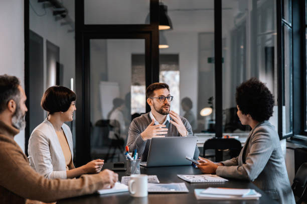 Team discussing regulatory briefing in a meeting room